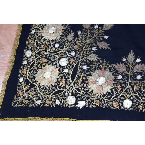 2562 - A large metal thread wall hanging decorated with a floral pattern 124 x 120cm .