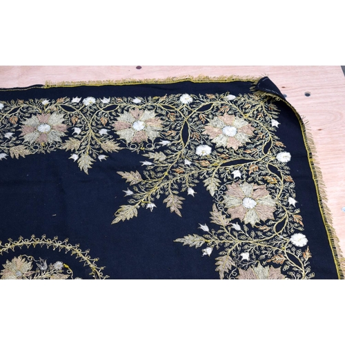 2562 - A large metal thread wall hanging decorated with a floral pattern 124 x 120cm .