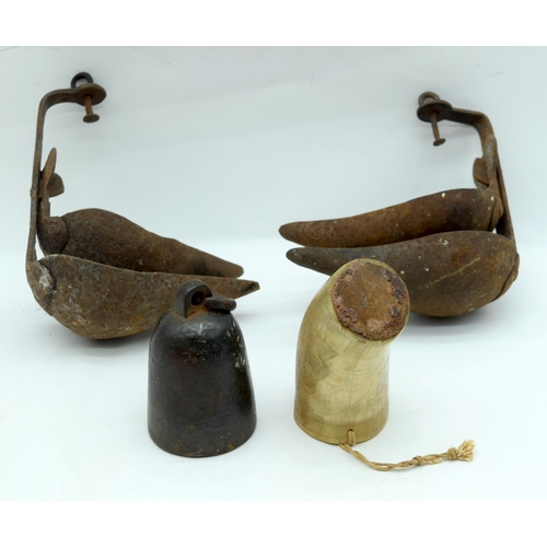 2564 - An engraved horn cup together with a pair of iron oil lamps and a bronze bell sounder. 24cm (4)