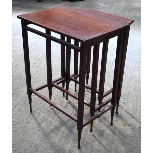 2572 - A NEST OF THREE EDWARDIAN MAHOGANY TABLES. Largest 64 cm x 45 cm.