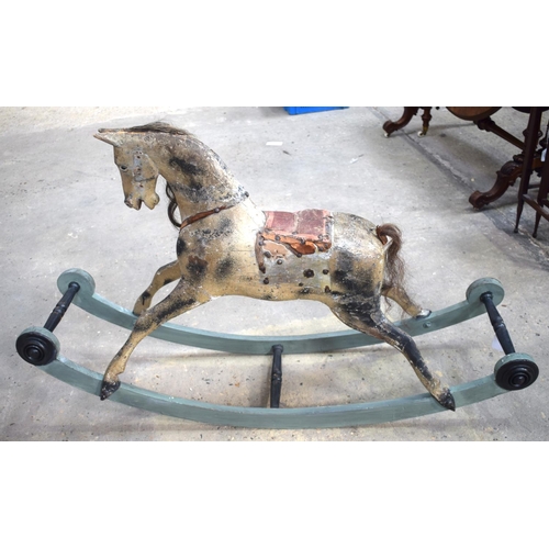 2573 - AN ANTIQUE ROCKING HORSE. 71 cm x 120 cm.