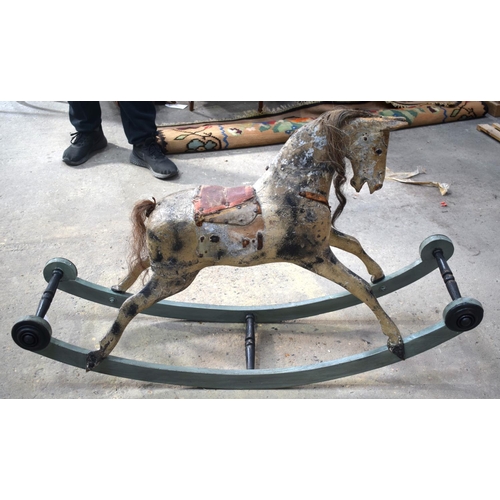 2573 - AN ANTIQUE ROCKING HORSE. 71 cm x 120 cm.