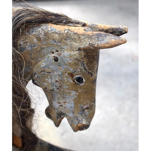 2573 - AN ANTIQUE ROCKING HORSE. 71 cm x 120 cm.