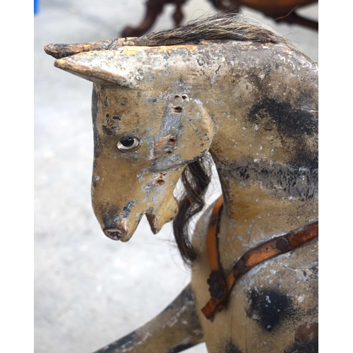 2573 - AN ANTIQUE ROCKING HORSE. 71 cm x 120 cm.