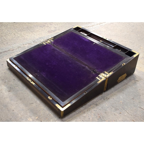 2576 - A FINE AND LARGE ANTIQUE CAMPAIGN TRAVELLING WRITING BOX with material slope and fitted interior. 61... 