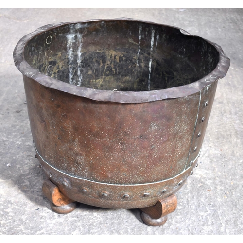 2580 - AN ANTIQUE COPPER RIVETED JARDINIERE upon a stand. 35 cm x 54 cm.