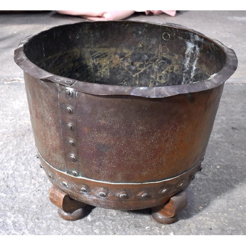 2580 - AN ANTIQUE COPPER RIVETED JARDINIERE upon a stand. 35 cm x 54 cm.