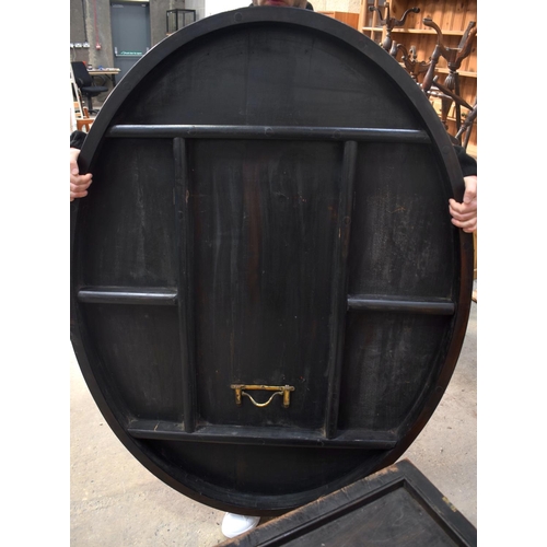 2588 - A LARGE VICTORIAN ROSEWOOD BREAKFAST TABLE upon a scrolling acanthus capped base. 148 cm x 73 cm.