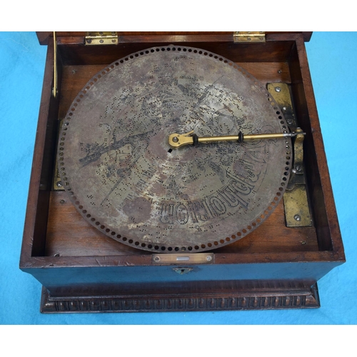 2589 - AN ANTIQUE SWISS MUSICAL SYMPHONIOM with separate discs. 45 cm x 22.5 cm.