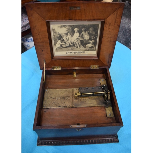 2589 - AN ANTIQUE SWISS MUSICAL SYMPHONIOM with separate discs. 45 cm x 22.5 cm.