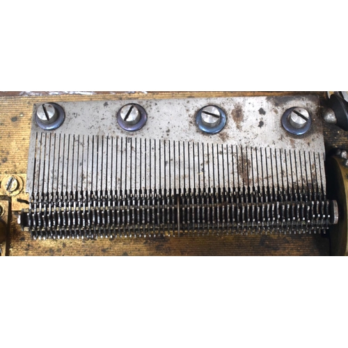 2589 - AN ANTIQUE SWISS MUSICAL SYMPHONIOM with separate discs. 45 cm x 22.5 cm.