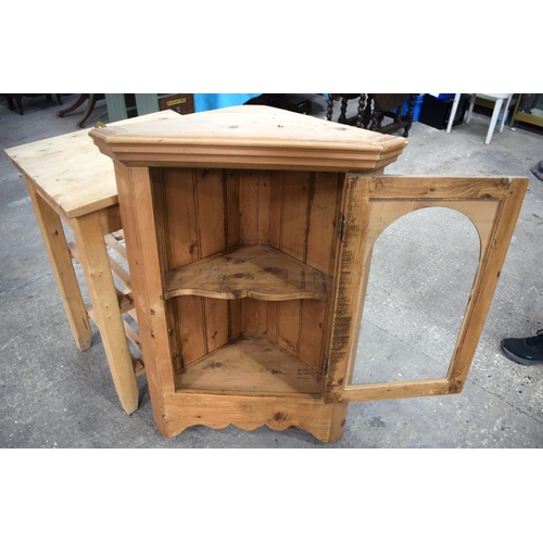 2597 - A PINE HANGING CORNER CUPBOARD and a butchers block. Largest 100 cm x 52.5 cm. (2)