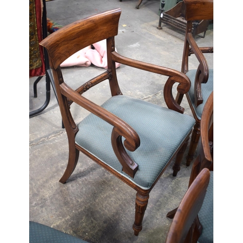 2600 - A SET OF EIGHT MAHOGANY REGENCY STYLE DINING CHAIRS with sunburst decoration to the supports and aca... 