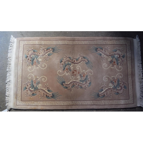 2602 - AN ART DECO STYLE CHINESE RUG. 154 cm x 87 cm.