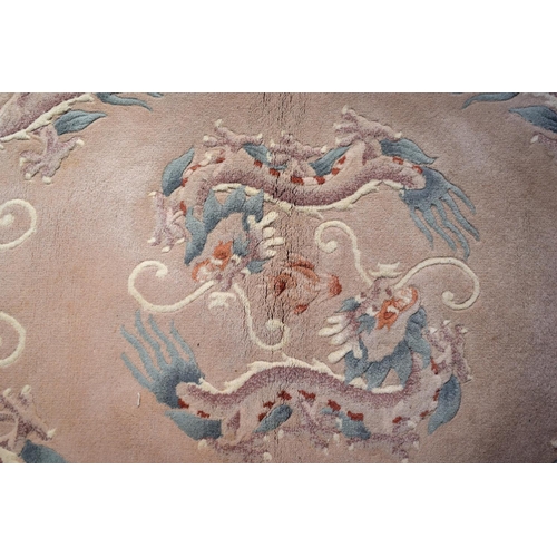 2602 - AN ART DECO STYLE CHINESE RUG. 154 cm x 87 cm.