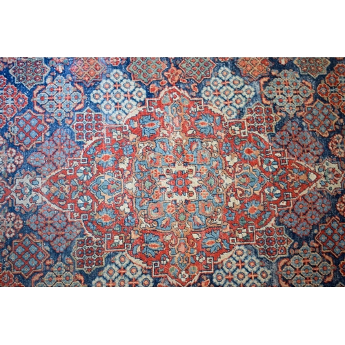 2604 - A LOVELY PAIR OF EARLY 20TH CENTURY MIDDLE EASTERN CARPETS decorated with foliage and vines. 218 cm ... 
