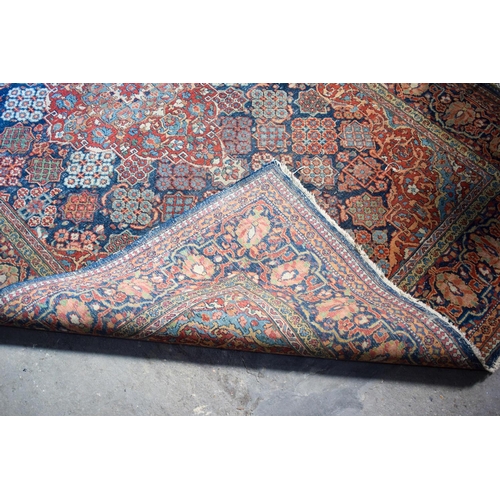 2604 - A LOVELY PAIR OF EARLY 20TH CENTURY MIDDLE EASTERN CARPETS decorated with foliage and vines. 218 cm ... 