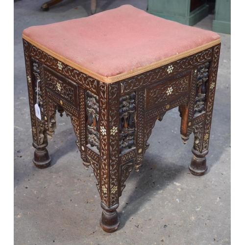 2607 - AN ARTS AND CRAFTS MOORISH CAIRO STOOL probably Liberty & Co. 47 cm x 40 cm.