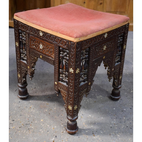2607 - AN ARTS AND CRAFTS MOORISH CAIRO STOOL probably Liberty & Co. 47 cm x 40 cm.