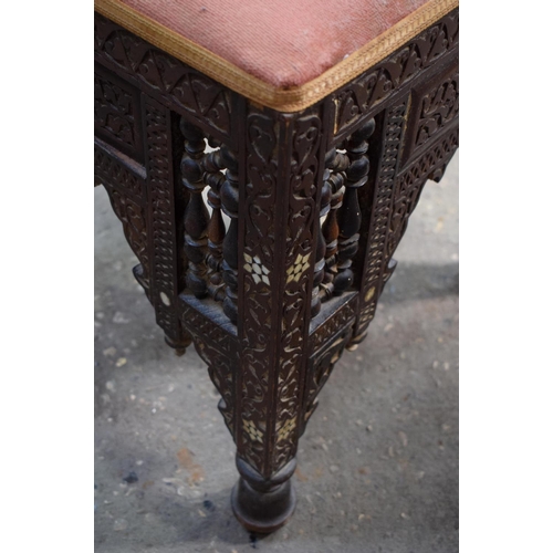 2607 - AN ARTS AND CRAFTS MOORISH CAIRO STOOL probably Liberty & Co. 47 cm x 40 cm.