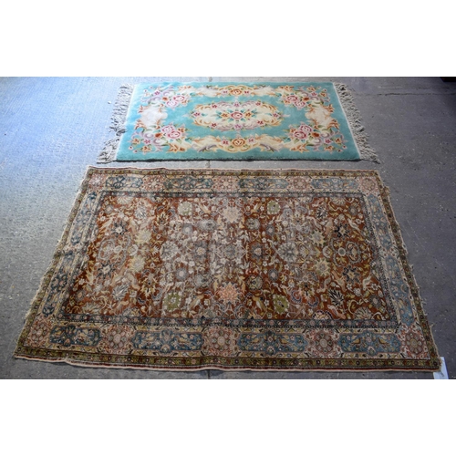 2611 - AN EARLY 20TH CENTURY MIDDLE EASTERN PERSIAN RUG together with a deco style rug. Largest 175 cm x 12... 
