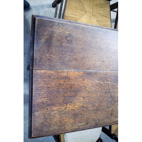 2616 - AN ERCOL STYLE DINING TABLE with five chairs. Table 146 cm x 70 cm. (6)