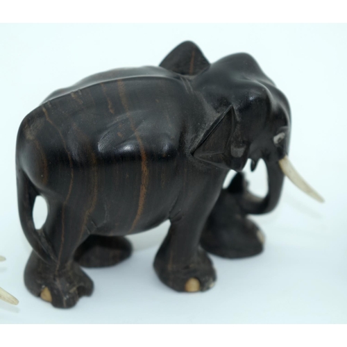 2528 - A Collection of African wooden Elephants and a page turner 13cm (6).