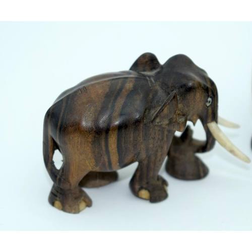 2528 - A Collection of African wooden Elephants and a page turner 13cm (6).