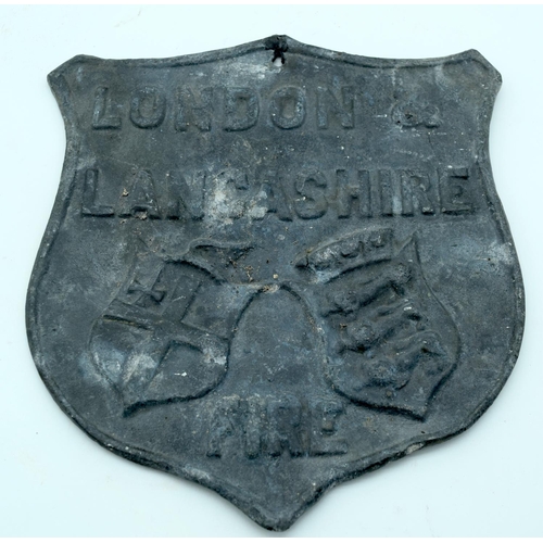 2533 - An antique London and Lancashire Fire Insurance lead plaque together with another lead plaque and  c... 