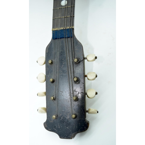 2548 - An antique Gennaro Maglioni mandolin with Mother of Pearl inlay 60cm .