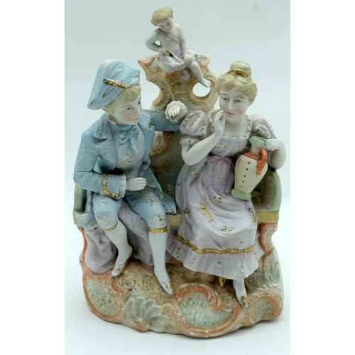 2559 - A large European Bisque figural group depicting cupid and a man and woman.31 x 21cm.