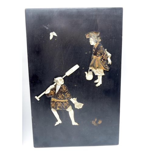 2561 - A pair of Japanese wooden panels decorated with carved Ivory figures 39 x 25cm (2)