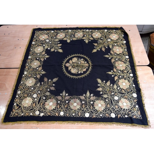 2562 - A large metal thread wall hanging decorated with a floral pattern 124 x 120cm .