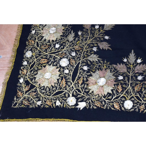2562 - A large metal thread wall hanging decorated with a floral pattern 124 x 120cm .