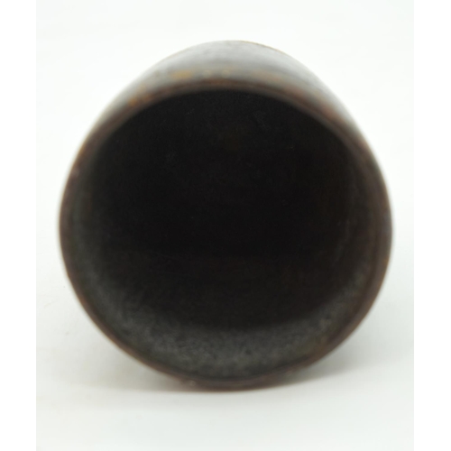 2564 - An engraved horn cup together with a pair of iron oil lamps and a bronze bell sounder. 24cm (4)