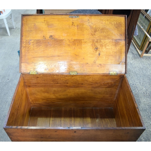 2567 - A VERY LARGE 19TH CENTURY OAK BOUND BRASS HANDLED COFFER of huge proportions. 106 cm x 59 cm.