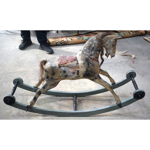 2573 - AN ANTIQUE ROCKING HORSE. 71 cm x 120 cm.