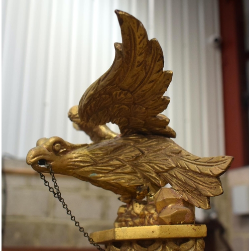 2584 - AN ANTIQUE GILTWOOD EAGLE MIRROR. 109 cm x 60 cm.