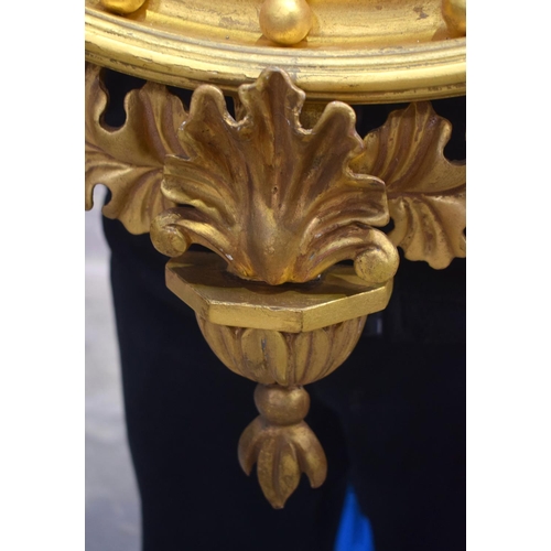 2584 - AN ANTIQUE GILTWOOD EAGLE MIRROR. 109 cm x 60 cm.