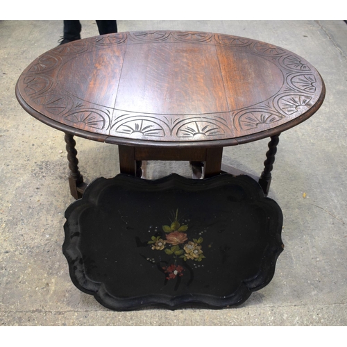 2596 - AN OAK GATELEG TABLE and a lacquer tray. 115 cm x 74 cm x 88 cm extended. (2)