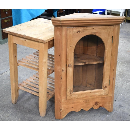 2597 - A PINE HANGING CORNER CUPBOARD and a butchers block. Largest 100 cm x 52.5 cm. (2)