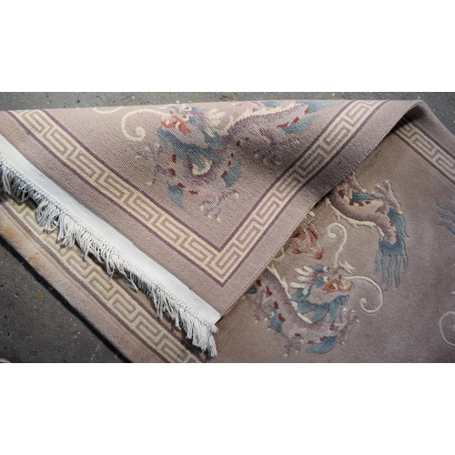 2602 - AN ART DECO STYLE CHINESE RUG. 154 cm x 87 cm.