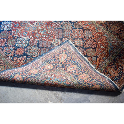 2604 - A LOVELY PAIR OF EARLY 20TH CENTURY MIDDLE EASTERN CARPETS decorated with foliage and vines. 218 cm ... 