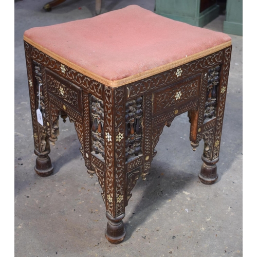 2607 - AN ARTS AND CRAFTS MOORISH CAIRO STOOL probably Liberty & Co. 47 cm x 40 cm.