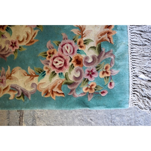 2611 - AN EARLY 20TH CENTURY MIDDLE EASTERN PERSIAN RUG together with a deco style rug. Largest 175 cm x 12... 