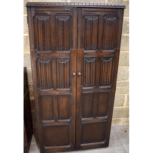 2613 - A MID CENTURY ERCOL TYPE WARDROBE together with a similar bureau. Largest 177 cm x 91 cm. (2)