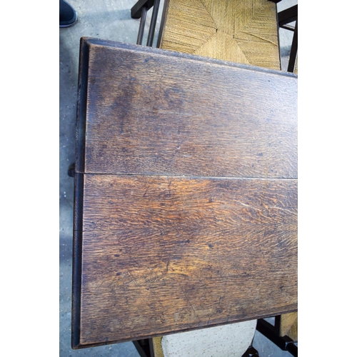 2616 - AN ERCOL STYLE DINING TABLE with five chairs. Table 146 cm x 70 cm. (6)