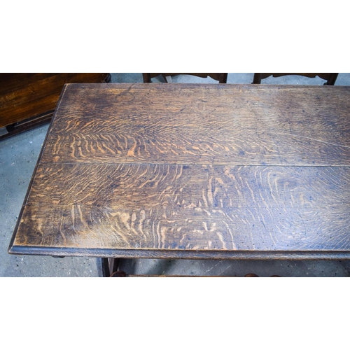 2616 - AN ERCOL STYLE DINING TABLE with five chairs. Table 146 cm x 70 cm. (6)