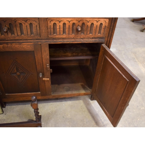 2617 - AN ERCOL CANTEEN together with a similar cupboard & a dressing table mirror. (3)