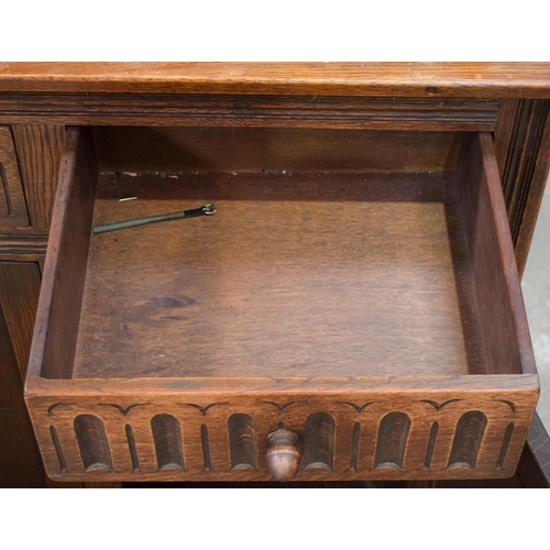 2617 - AN ERCOL CANTEEN together with a similar cupboard & a dressing table mirror. (3)